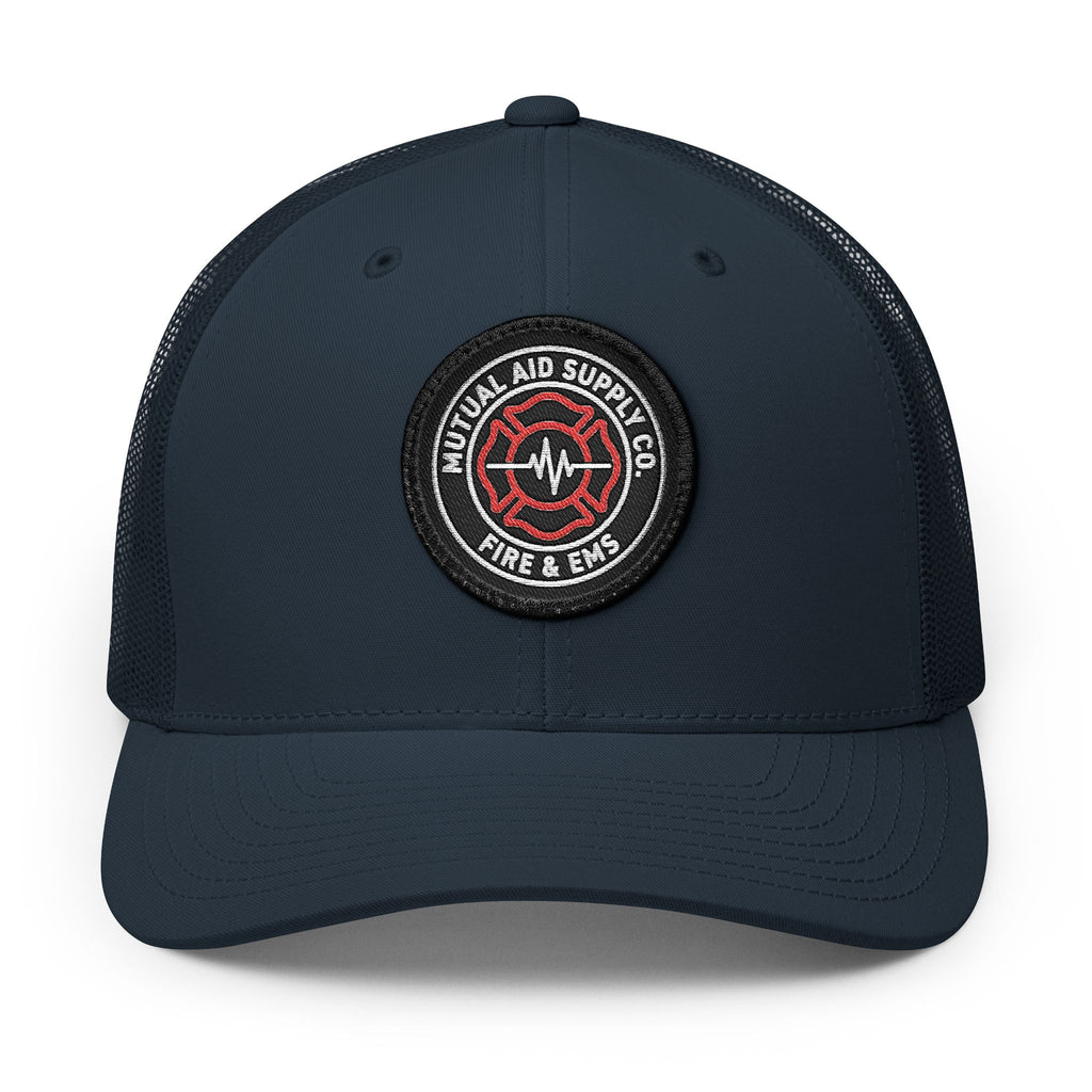 Mutual Aid Crest Patch Trucker Cap — front view
